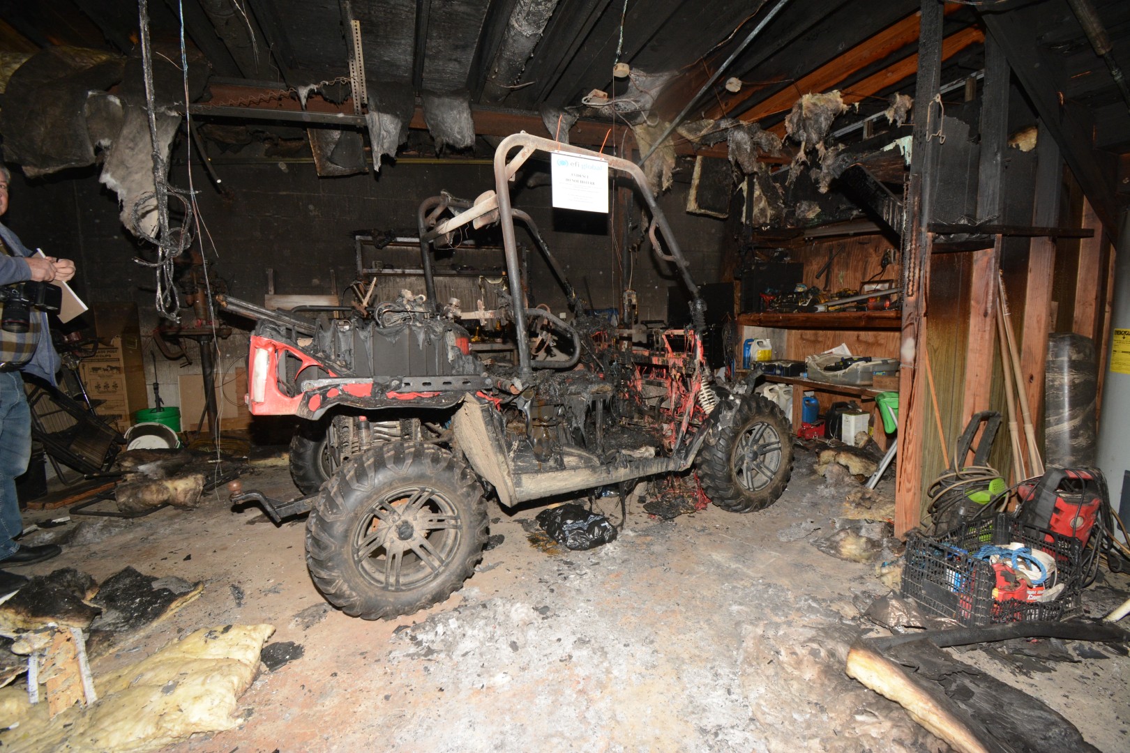 Burned golf cart in a garage